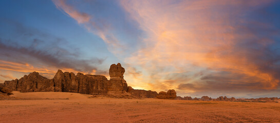 Outcrop geological formations at sunset near Al Ula in Saudi Arabia - obrazy, fototapety, plakaty