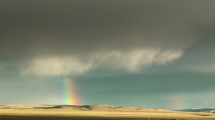 Sunset in Tibet. A raining clouds and rainbow Time Lapse