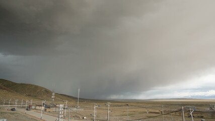 Massive dark clouds before thunder cover blue sky Tibet