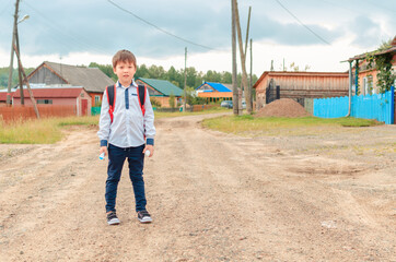Asian child boy student in school uniform medical face mask and sanitizer back to school epidemic...