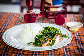  STIR FRIED CRISPY BASIL WITH PORK AND BLACK PRESERVED EGGS