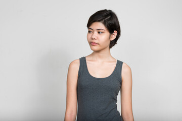 Obraz premium Portrait of young beautiful teenage girl with short hair thinking
