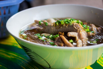 Asian delicatessen - chicken foot in noodle soup