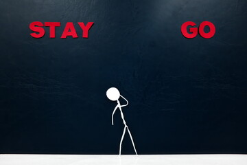 Human stick figure confused over stay or go word cutout. Stay versus leave concept.