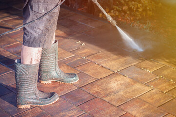 Outdoor floor cleaning with high pressure water jet