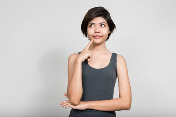 Obraz premium Portrait of young beautiful teenage girl thinking
