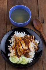 Thai food gourmet steamed chicken with rice , khao mun kai in wood background