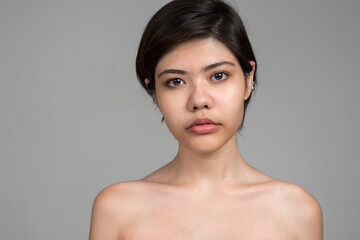 Portrait of young beautiful teenage girl with short hair shirtless