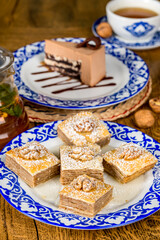 Oriental dessert baklava on a plate with a pattern