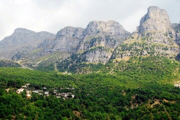 Fototapeta na wymiar Panoramic view of Tymfi Mountain and Mikro Papigko village, one of the 45 villages known as Zagoria or Zagorochoria in Epirus region of southwestern Greece.