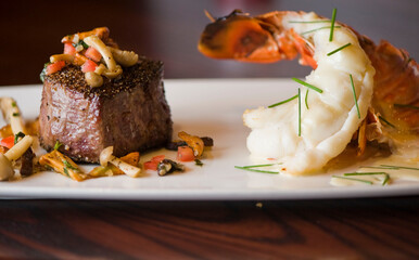 Lobster tail, served with drawn butter and lemon wedges. Maine lobster tail, classic American restaurant favorite. Seasoned with salt and pepper and garnished with Italian parsley.