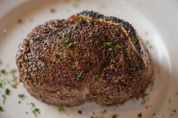 Steak. Grass-fed skirt steak, grilled to a medium rare and served with a garlic herb butter sauce and paired with roasted potatoes and Brussels sprouts. Classic American steakhouse favorite.