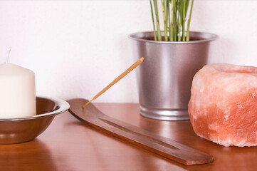 Feng shui style home decor with incense and plant