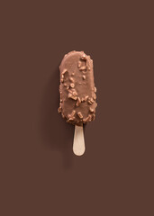 vanilla and chocolate ice cream popsicle on a brown background,