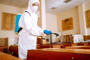 Disinfectant sprayers with spray chemicals in  school class. Concept of protect from infection of...