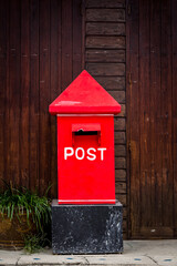 Mail Box In front of a House.