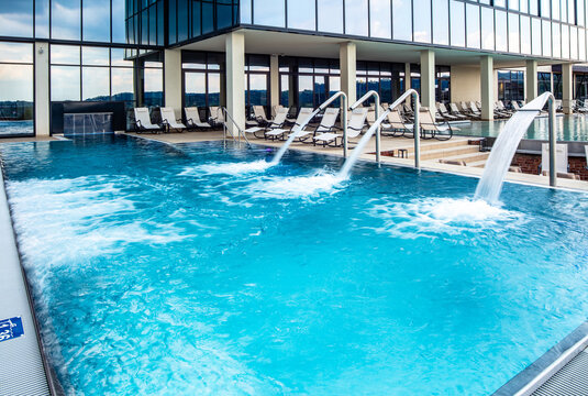 Outdoor swimming pool at luxury hotel. © Drazen