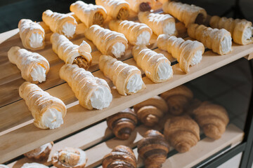 Sweet dessert buns on a store shelves or bakery