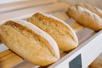 Fresh crispy bread on a store shelves or bakery