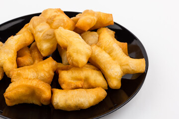 Deep-fried doughstick def and screw pine (Thailand breakfast) on white background.