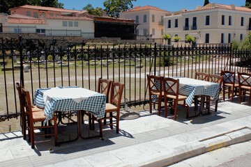 Greece, Athens, June 28 2020 - Empty chairs and tables of a traditional restaurant in the touristic district of Plaka. 