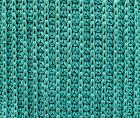 Green Knitted Pattern. Crocheted Fabric Texture