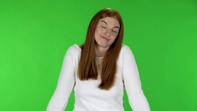 Portrait of pretty young woman is upset, shrugging and spreads his hands .