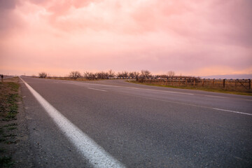 asphalt road at the sunset