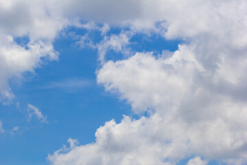 Fantastic soft white clouds against blue sky