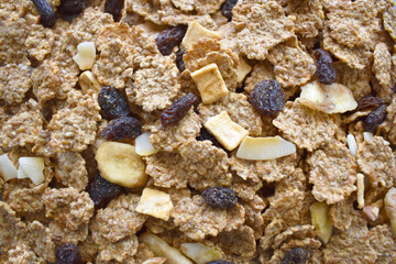 Fruit and fiber cereal texture background. The concept of healthy breakfast, healthy food, dietary plan and weight loss program. Selective focus. 