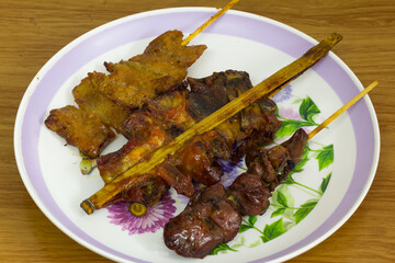 Thai style food with grilled pork Grilled liver and grilled chicken