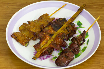 Thai style food with grilled pork Grilled liver and grilled chicken