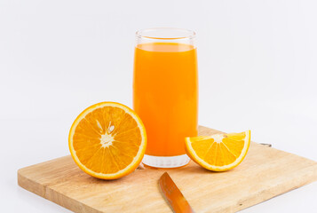 Orange juice and slices of orange on white background