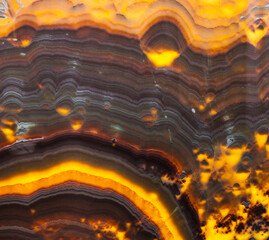 Brown and yellow orange striped natural onyx texture