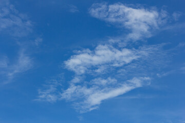 Fantastic soft white clouds against blue sky