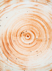 brown circles on light background and black ruffle. spiral.