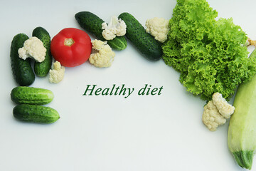 text healthy diet and fresh vegetables isolated on white background