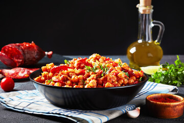 close-up of Garbanzos fritos in a black bowl