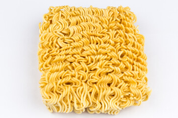 A block of uncooked Ramen Noodles on white background.