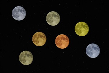 Fototapeta na wymiar Full moon multiple multicolored on black sky with stars composite