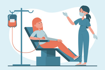 Female blood donor sitting in hospital laboratory