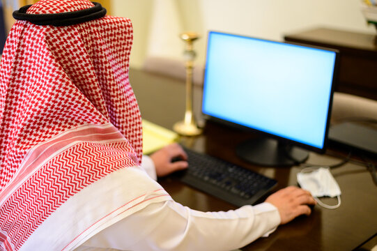 Arabic Man From Saudi Arabia Working At Home To Protect Him Self From The Viruses Pandemic COVID-19 