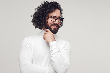 Bearded man smiling and looking away