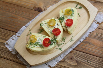 Omelette roll stuffed with cheese with garlic and herbs and a glass of wine
