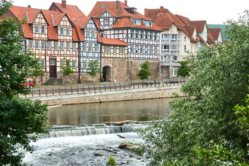 Street with half-timbered houses in Hann. Muenden, Germany, behind the weir of the Werra before confluence with the Fulda