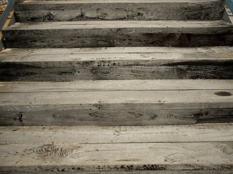 Old wooden grey colour railway overpass staircase in Hungarian rural area