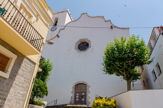  View of The church is dedicated to Santa Maria de les Neus in Port de la Selva, one of the most touristic villages of Costa Brava, on  9 July 2020, in Port de la Selva, Catalonia, Spain.