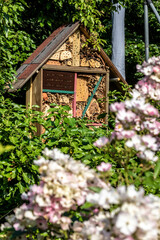 Fototapeta na wymiar home made insect hotel in garden
