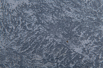 cold bluish smooth background of building plaster applied to a wooden base