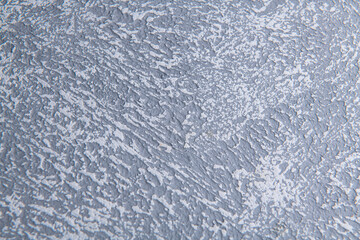cold bluish smooth background of building plaster applied to a wooden base